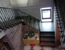Частный дом. Облицовка лестницы из бетона, изготовление и монтаж кованых ограждений 